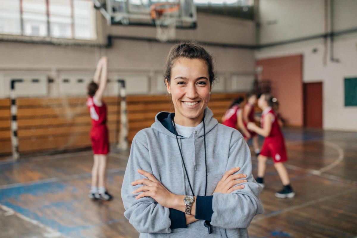 Lady basketball coach on court